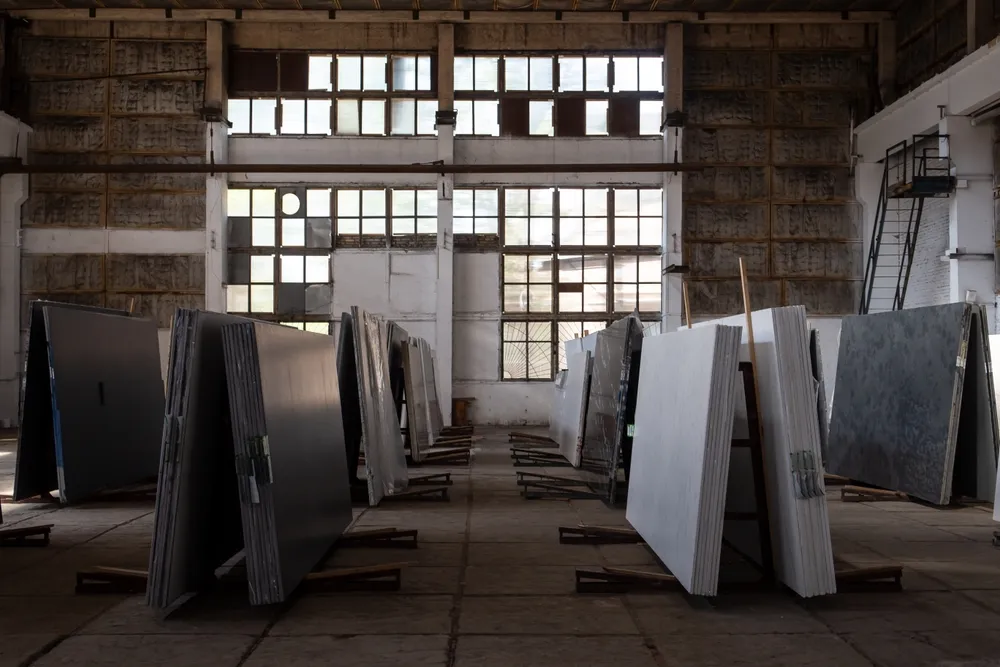 Stone fabrication warehouse with slab inventory
